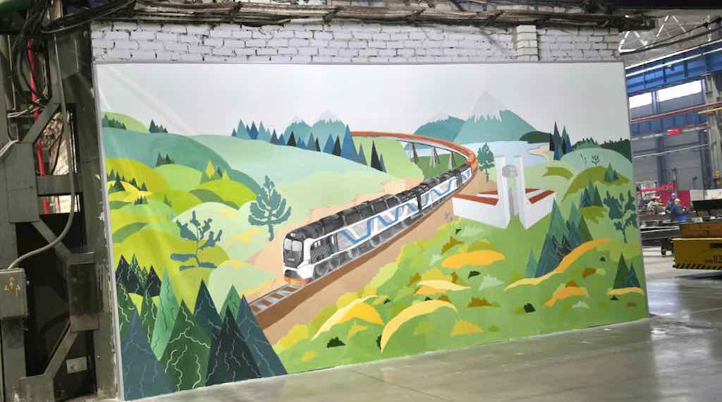 Студенты создали на БМЗ граффити с тепловозом в производственном цехе